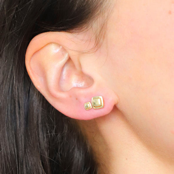 Mini Chocolate Gold Stud Earrings on a model