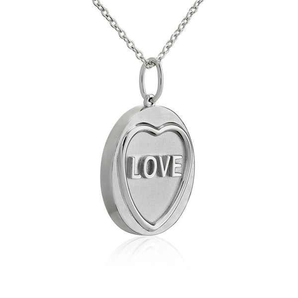 The side profile of a silver love heart necklace