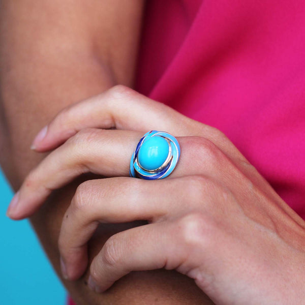 Rock Candy bespoke ring featuring a turquoise and blue enamel on 18ct yellow gold worn on a model