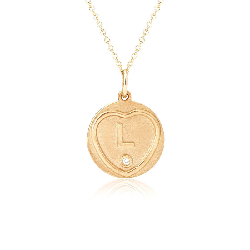 The Gold L initial Charm on a gold chain hand made by origin 31 in Surrey