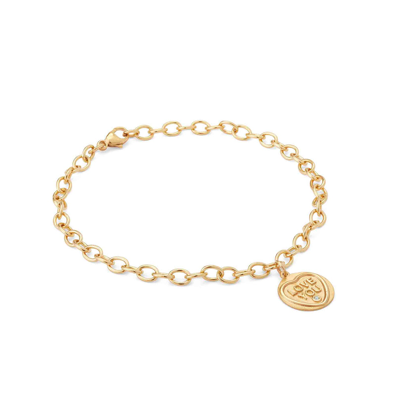 A side view of a gold charm bracelet featuring the Love Hearts 18ct gold  personalised charm, Love You