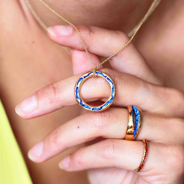 Rock Pool Large Electric Blue Sapphire Gold Pendant Link worn on model with the rock pool electric blue sapphire wide ring