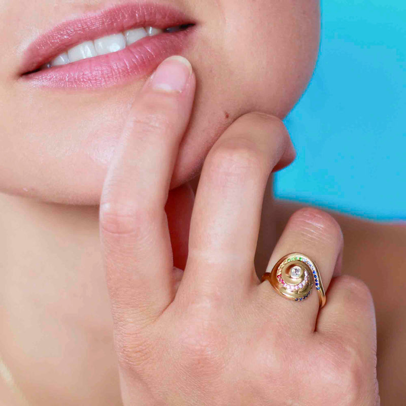 Rock Pool Rainbow Spiral Ring on the finger in 18 ct yellow gold